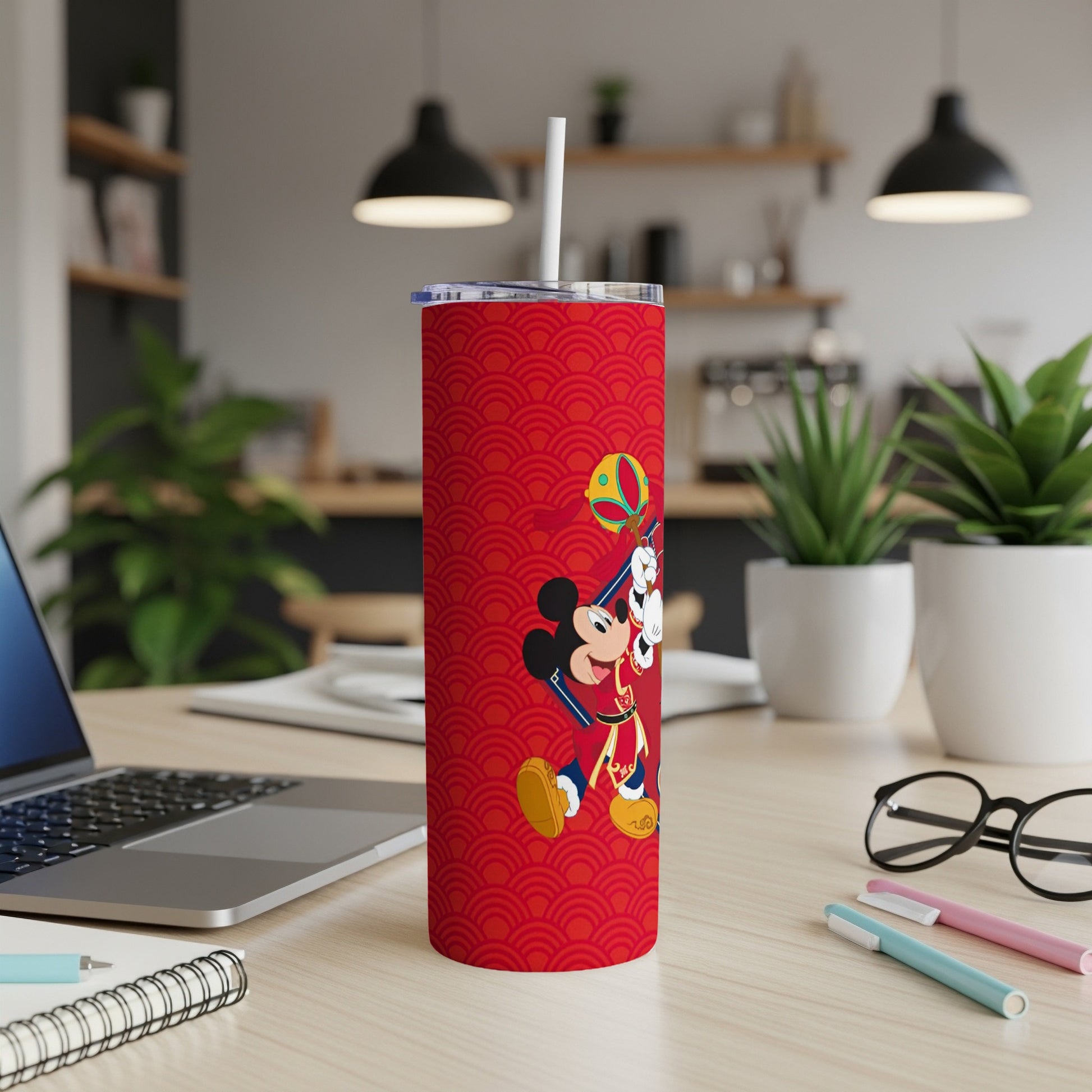 Red tumbler with Mickey Mouse in festive attire holding a lantern.