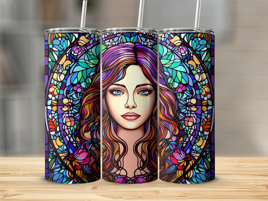 Stained glass tumbler featuring a woman's face surrounded by colorful floral patterns.