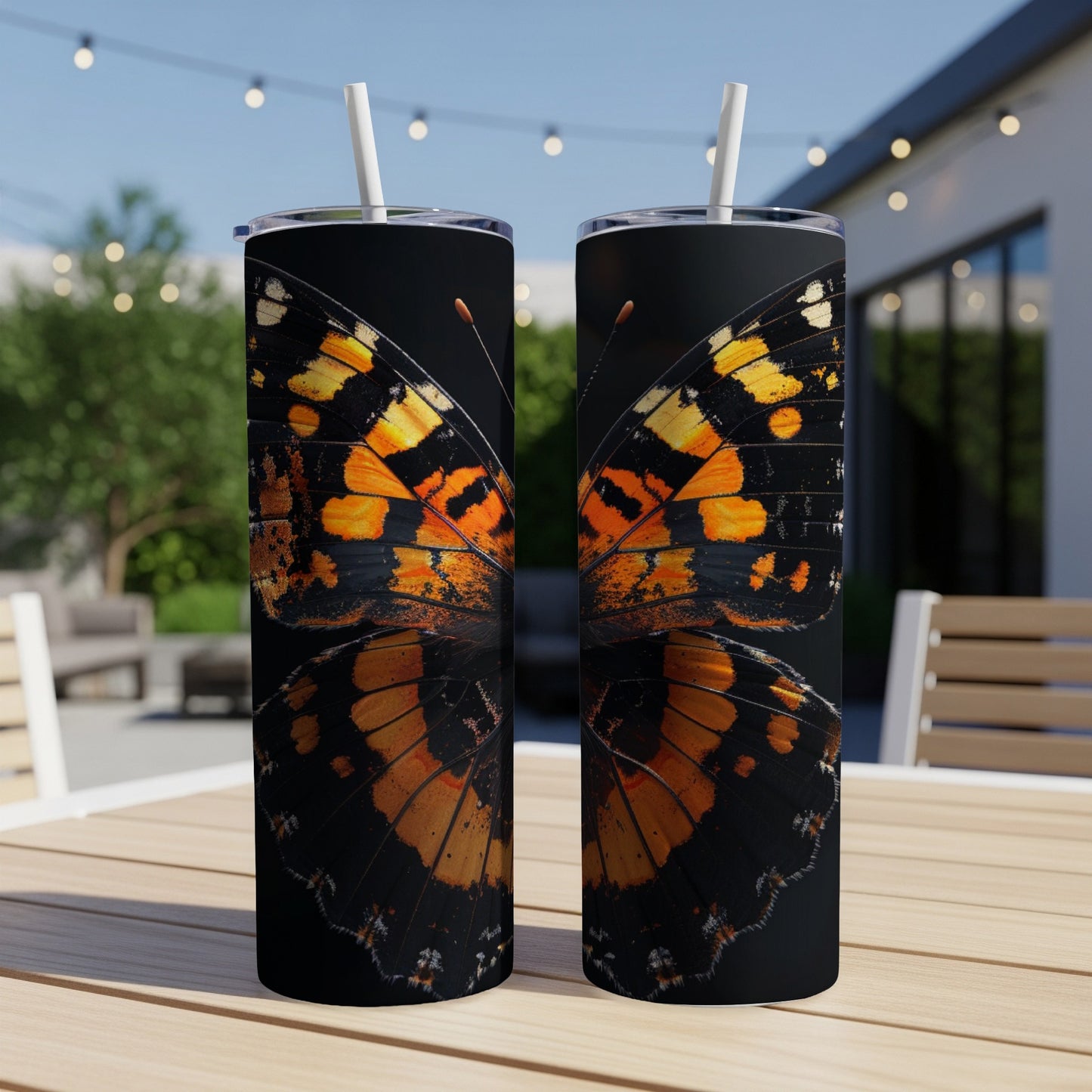 Two tumblers featuring a close-up of a monarch butterfly's wing pattern.