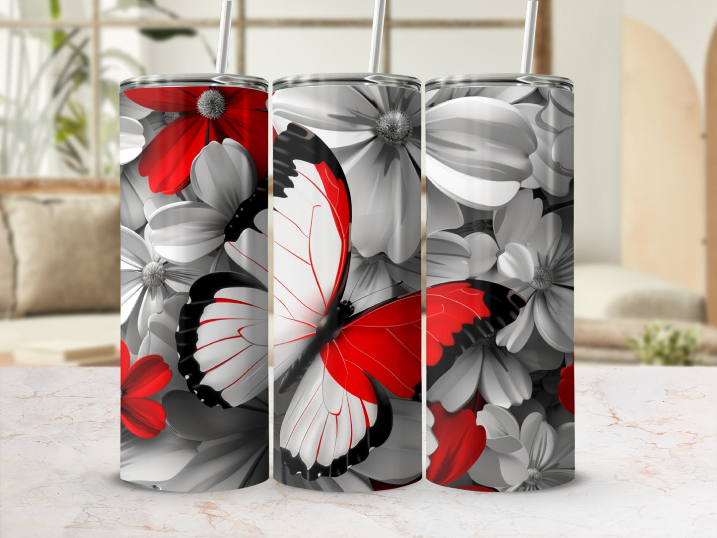 Three tumblers with red and white butterflies and floral designs.