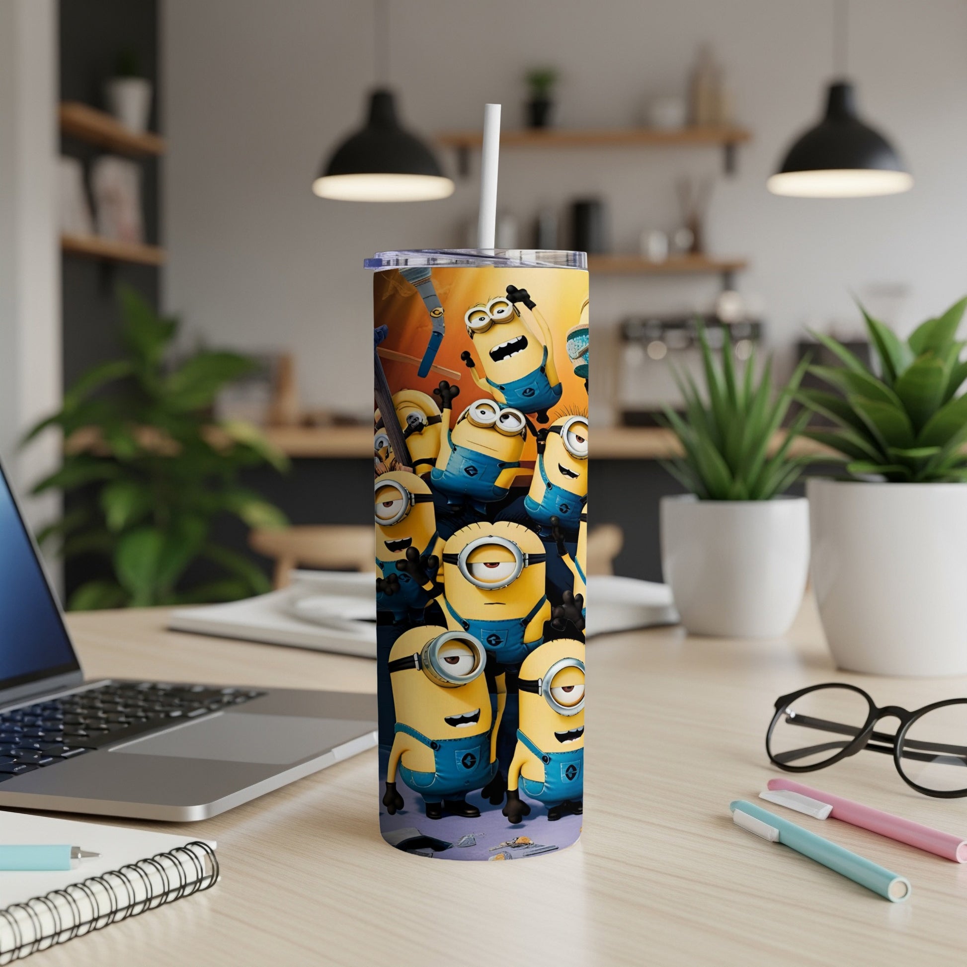Minions characters in a playful pattern on a tall tumbler with a straw.