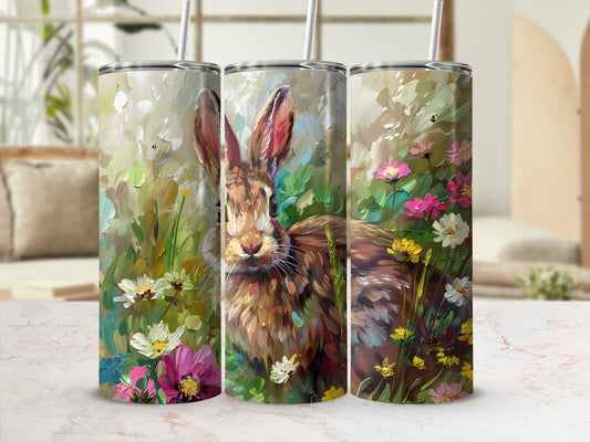Three tumblers featuring a painted bunny among wildflowers.