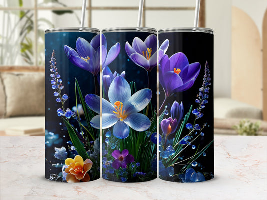 Three tumblers with purple and blue floral designs and straw lids.