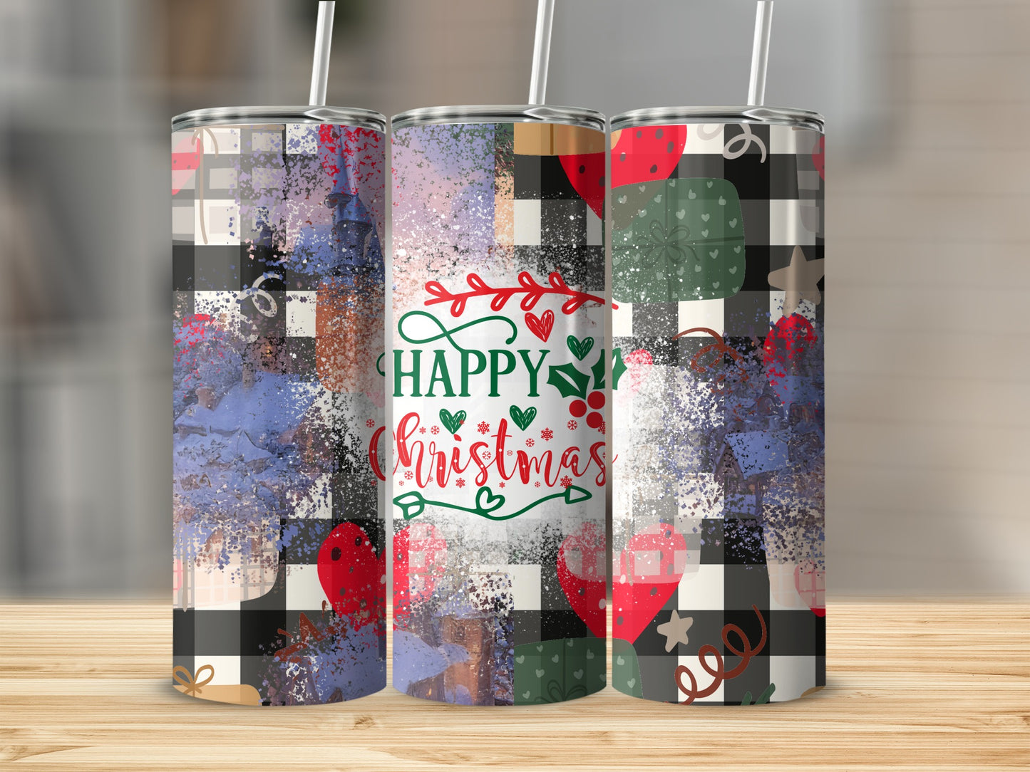 Three tumblers with "Happy Christmas" and plaid and abstract designs.