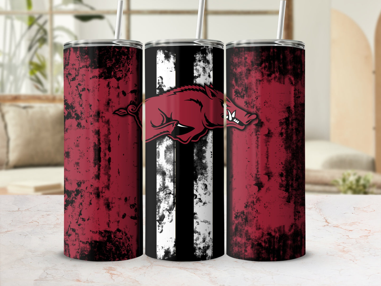 Three tumblers with a distressed red and black design and a running boar logo.