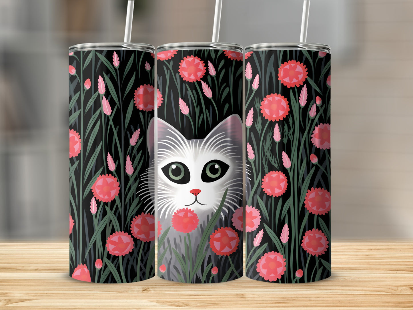 Three tumblers with a black floral pattern and a cat face in the center.