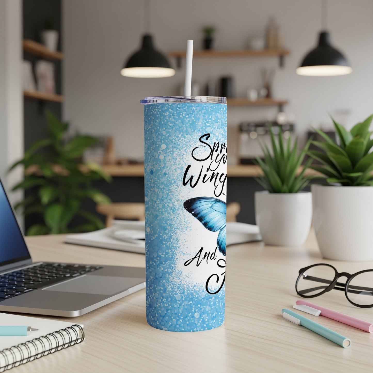 Blue speckled tumbler with butterfly and text "Spread your wings and fly".