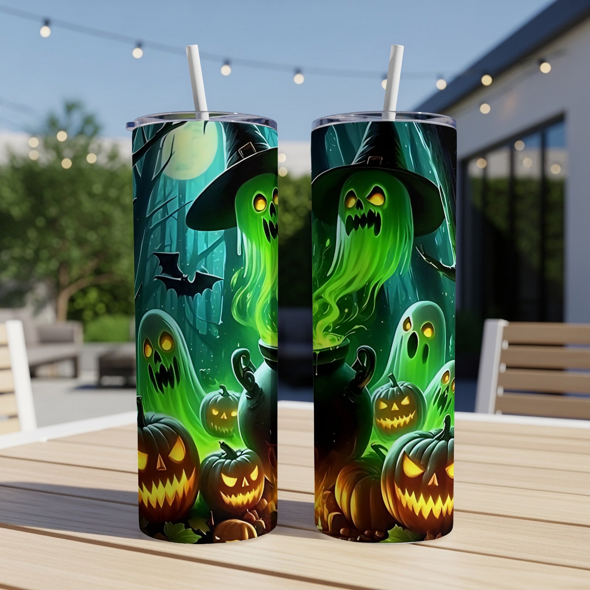 Two Halloween-themed tumblers with ghosts and jack-o'-lanterns on a table.