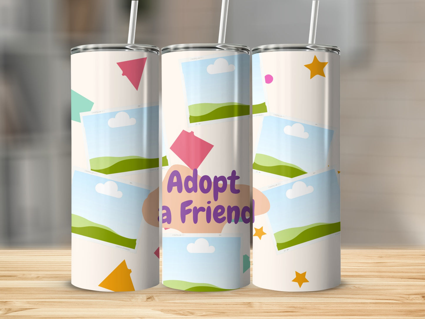 Tumblers with "Adopt a Friend" text, photo frames, and colorful shapes on a light background.