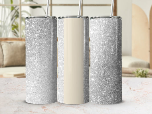 Three silver glitter tumblers with a cream stripe on a marble surface.