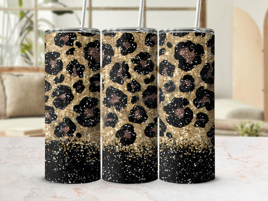 Three tumblers with leopard print and gold glitter designs.