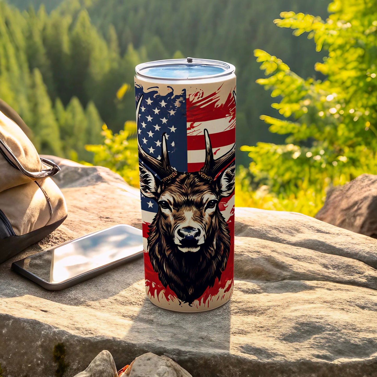 Deer head with American flag design on a tumbler, outdoors.