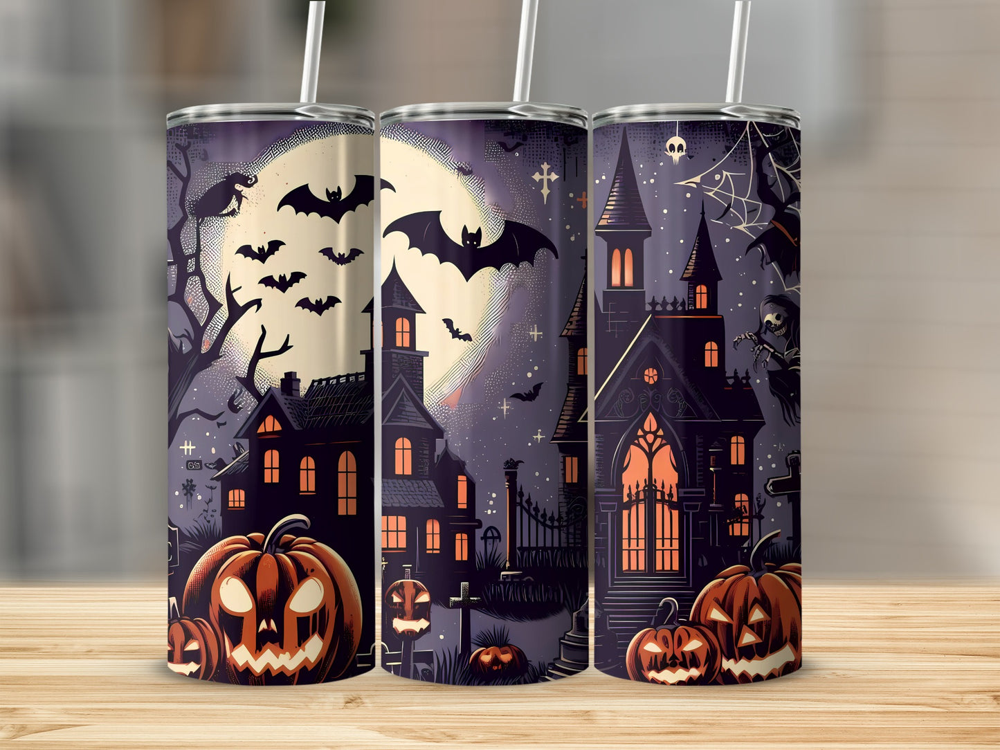 Three tumblers with Halloween art featuring haunted houses, pumpkins, bats, and a full moon.