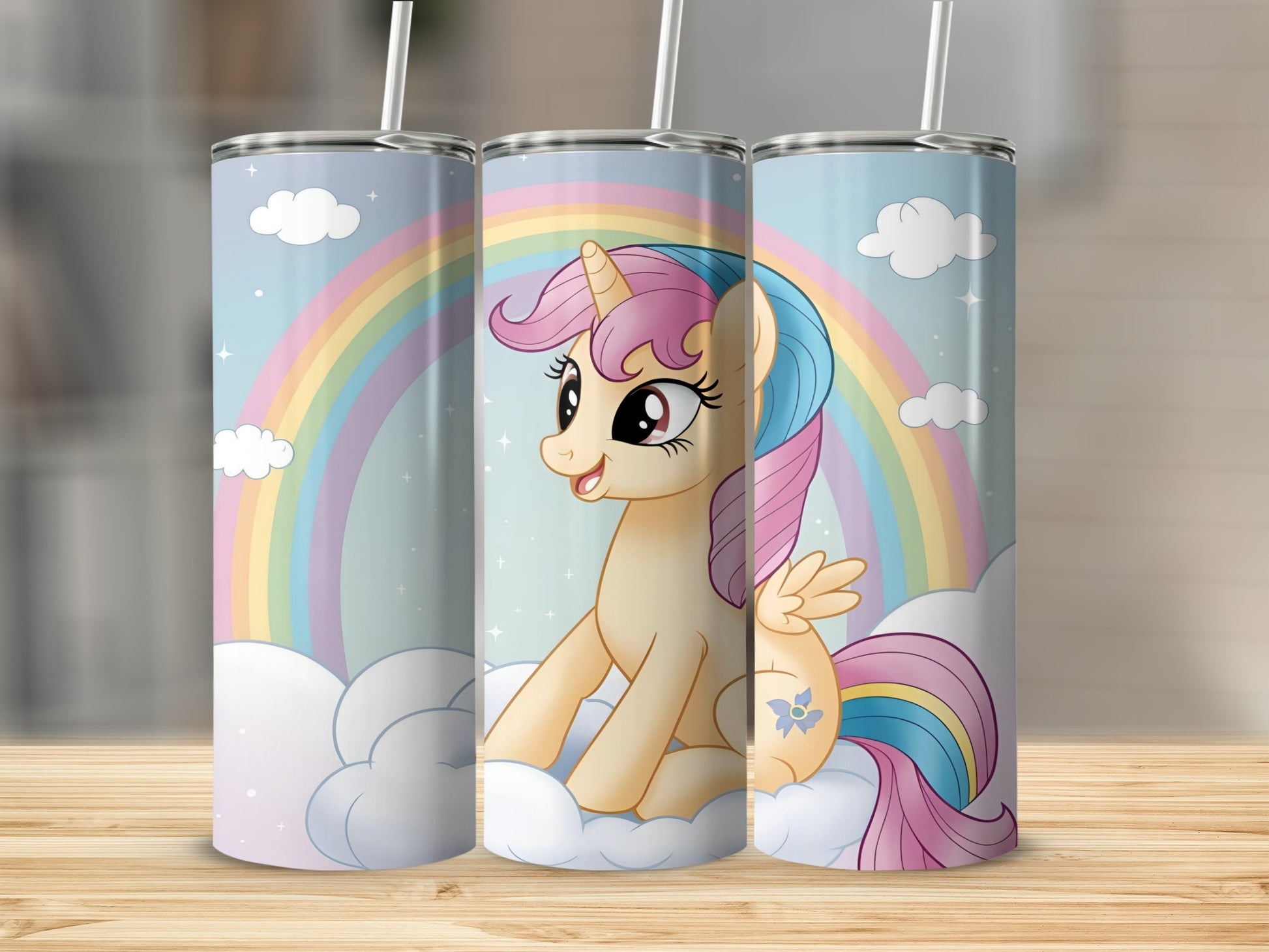 Cartoon unicorn with rainbow and clouds on a tumbler.