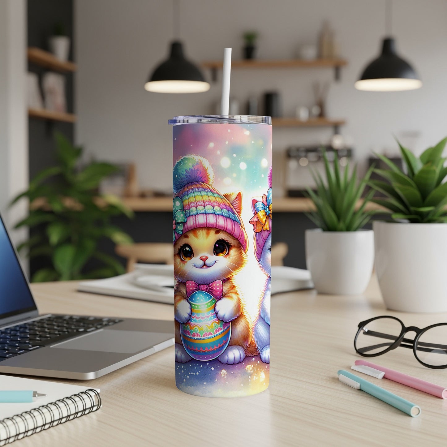 Cute cat wearing a colorful hat holding an Easter egg on a tumbler.