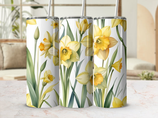 Three tumblers with a watercolor daffodil floral pattern.