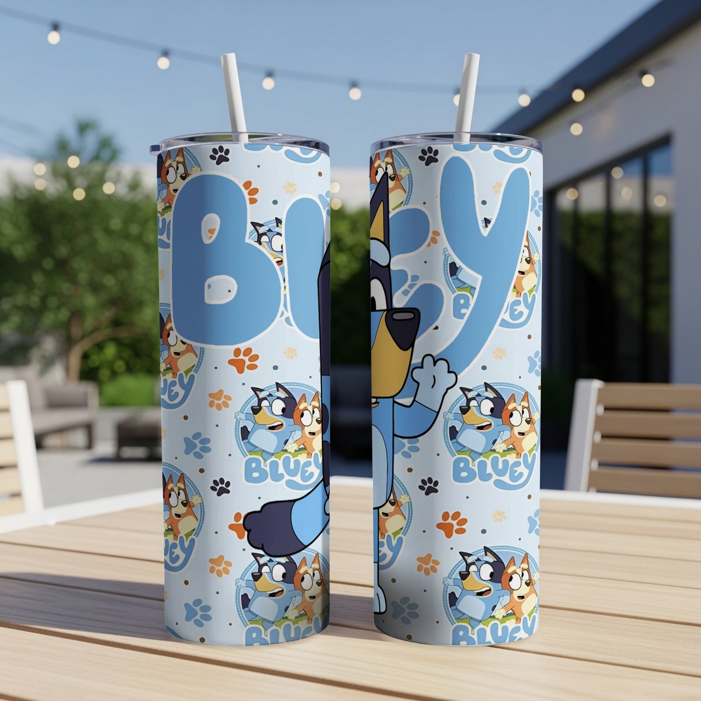Bluey characters and paw prints pattern on light blue tumbler with straw.