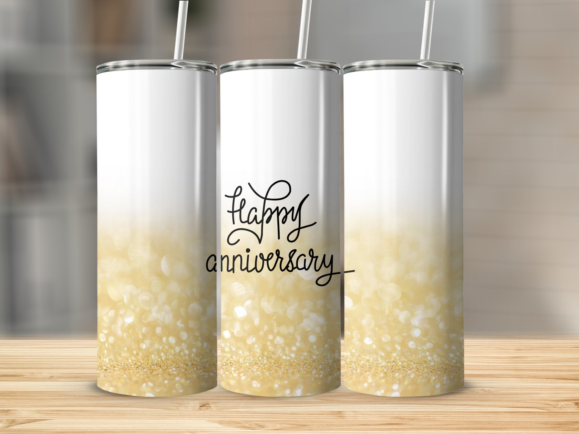 Three white tumblers with "Happy Anniversary" text and gold glitter accents.