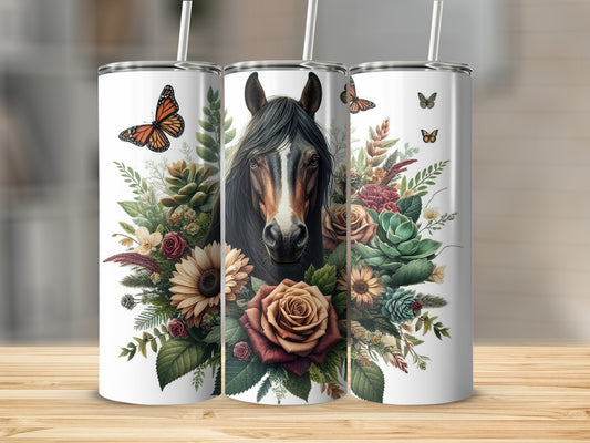 Horse head surrounded by flowers and butterflies on a white tumbler.