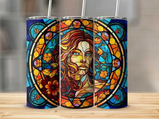 Stained glass tumbler featuring a woman's face with flowing hair and floral accents.