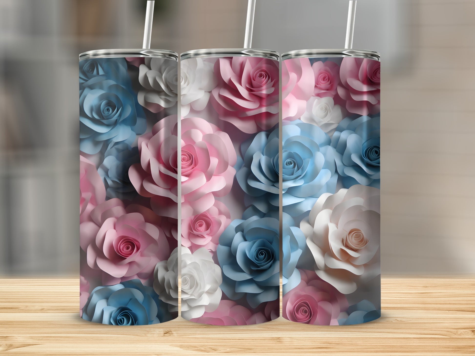 Three tumblers with a floral pattern of pink, blue, and white roses.