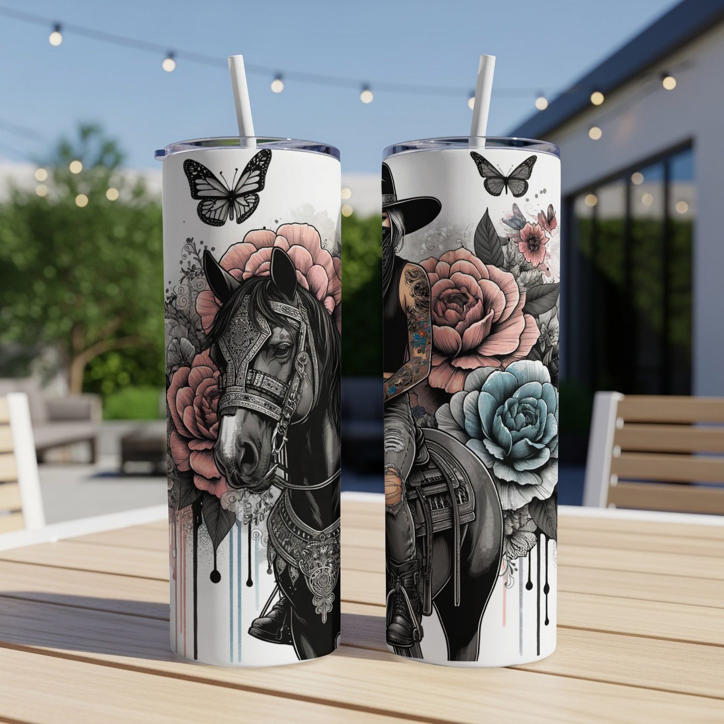 Cowboy on horseback with butterflies and roses design on two tumblers.