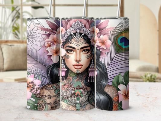 Tumbler with floral and peacock feather design and inspirational quote.