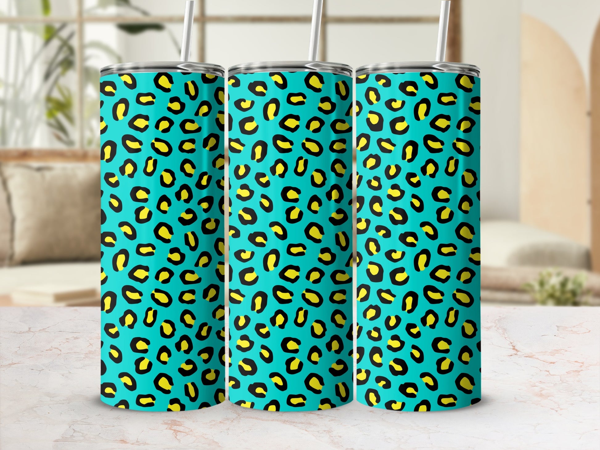 Three tumblers with teal background and yellow and black leopard print pattern.
