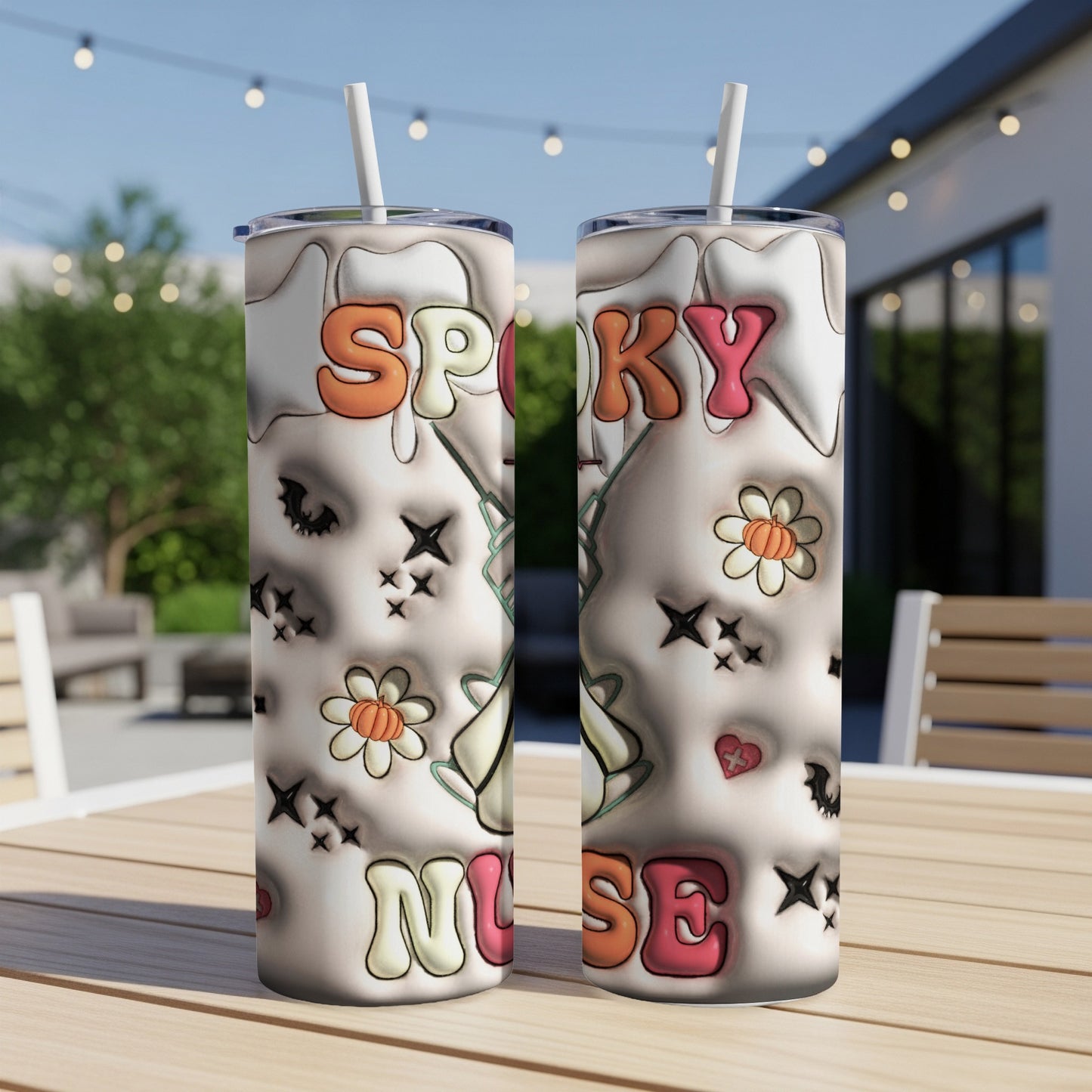 Two tumblers with "Spooky Nurse" text and ghost, flower, and heart designs.