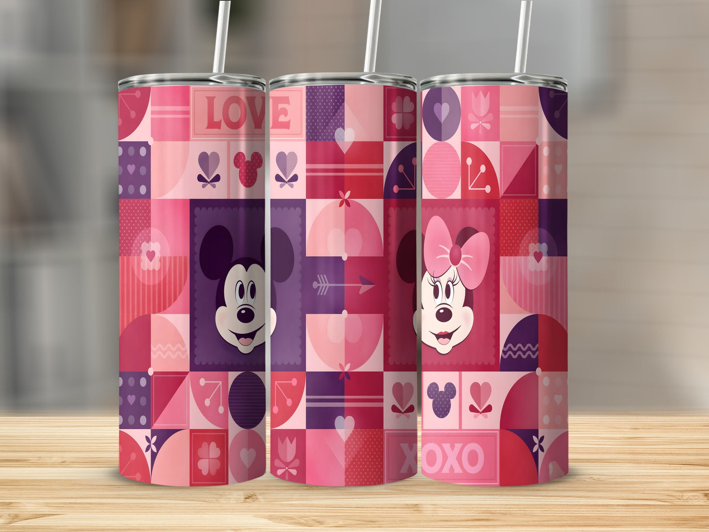 Mickey and Minnie Mouse tumblers with pink and purple geometric patterns.