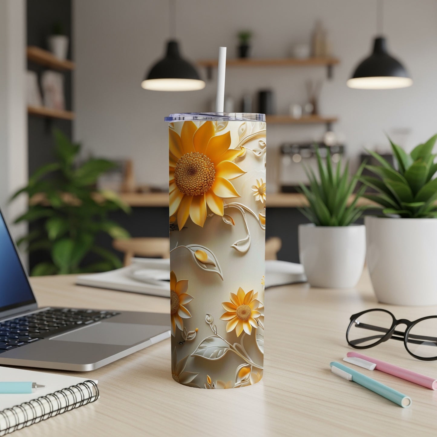 Tall tumbler with embossed sunflowers and floral accents.