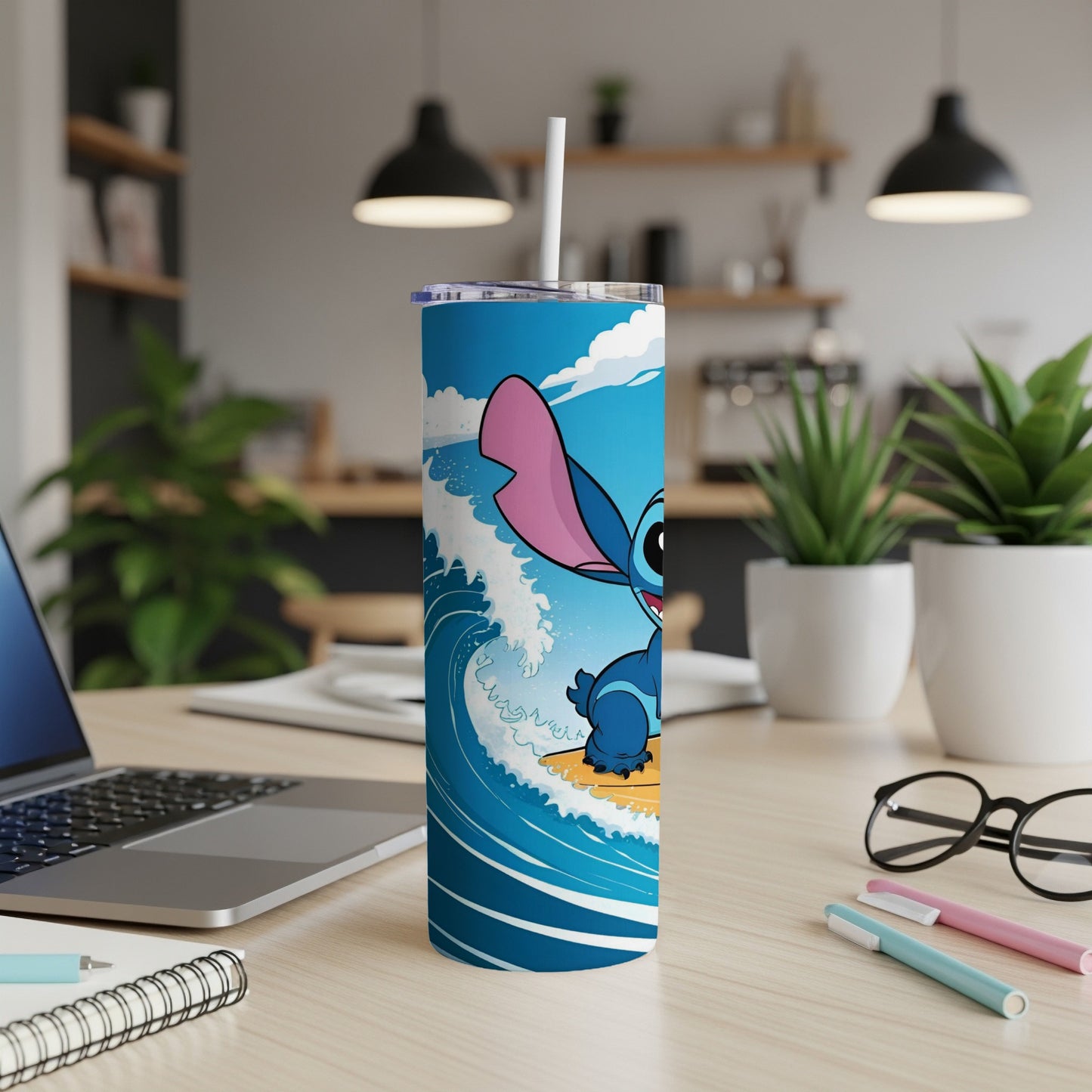 Stitch character surfing on a wave on a blue and white patterned tumbler.