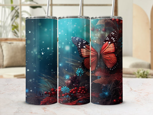 Butterfly and pine branch design on a skinny tumbler with straw.