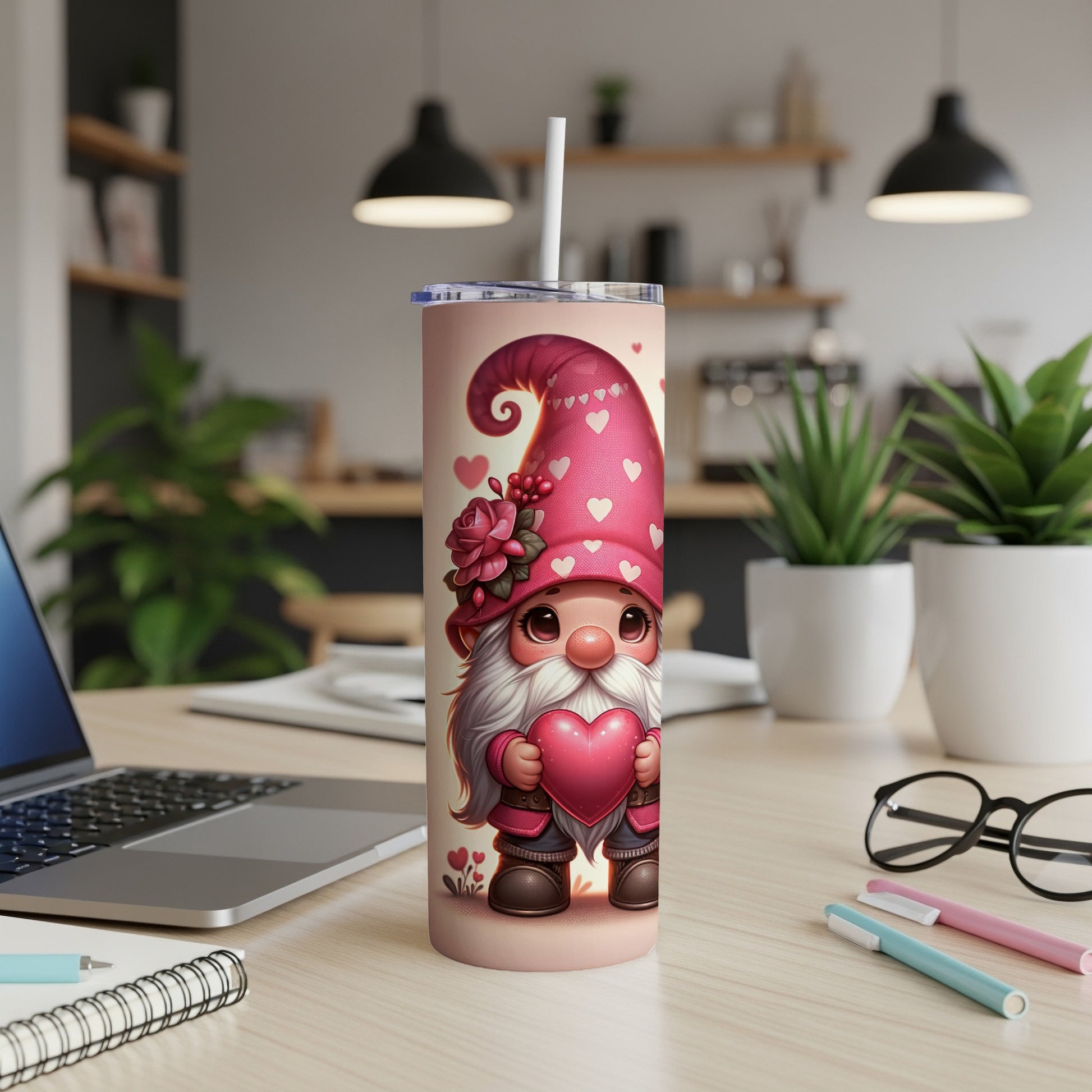 Gnome with heart on pink tumbler, office desk background.