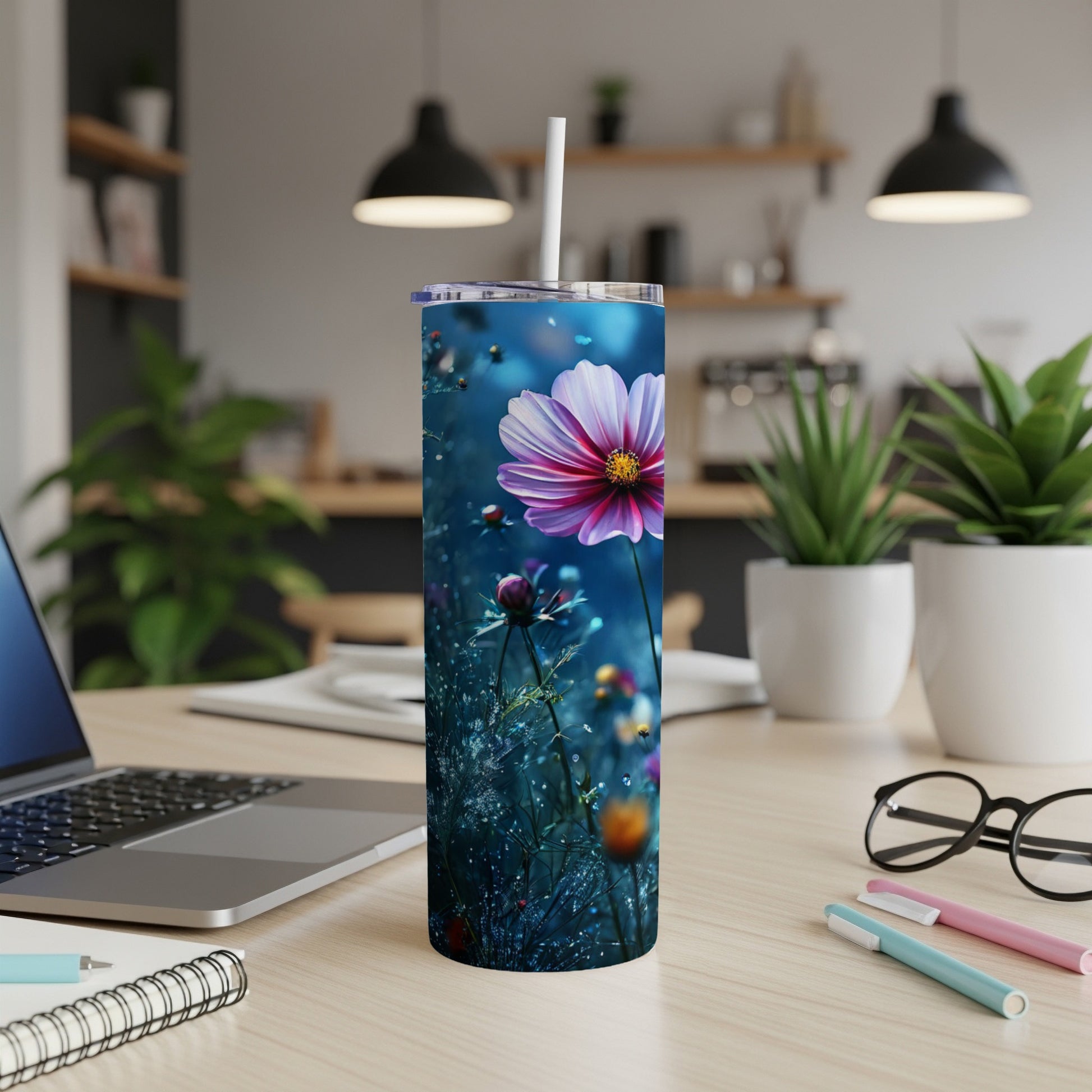 Tall tumbler with a vibrant pink and purple flower on a dark blue, dewy background.