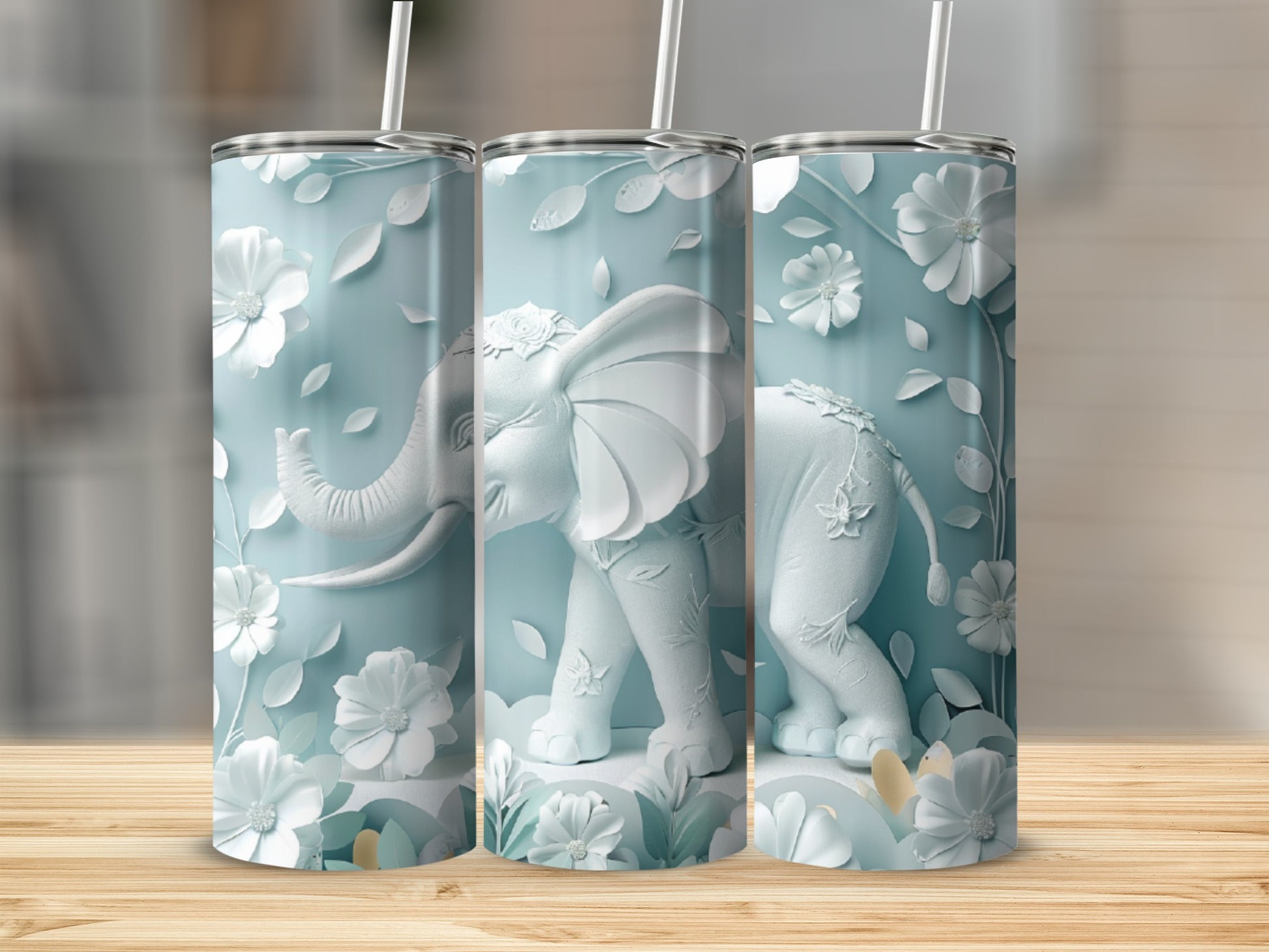 White elephant and floral design on a tall, slender tumbler.