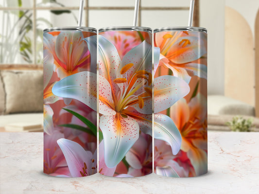 Floral pattern tumbler with lilies and straws, displayed on a marble surface.