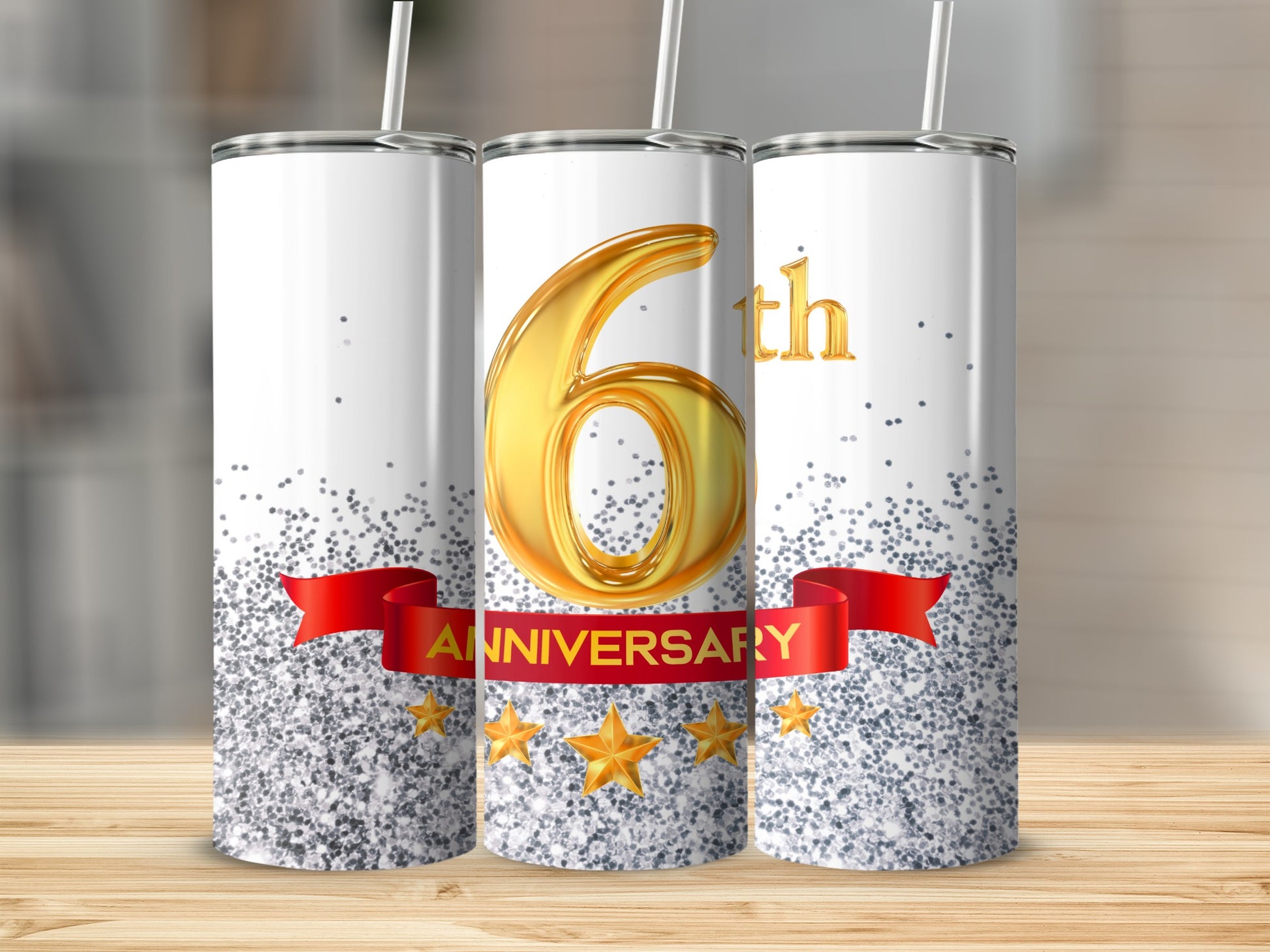 Silver glitter tumbler with large gold "6th Anniversary" text on red banner.