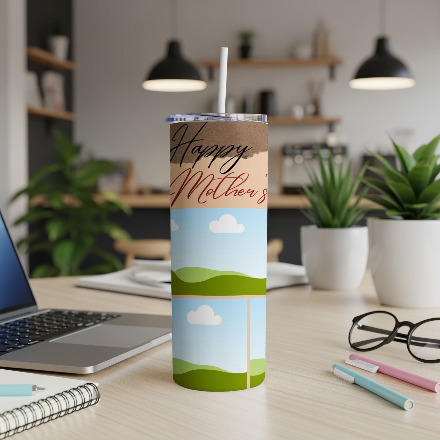 Tumbler with "Happy Mother's" text and two framed landscape scenes.