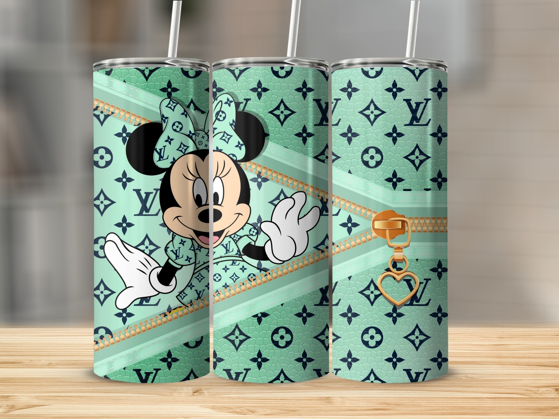 Minnie Mouse on a mint green tumbler with LV monogram pattern and gold zipper detail.