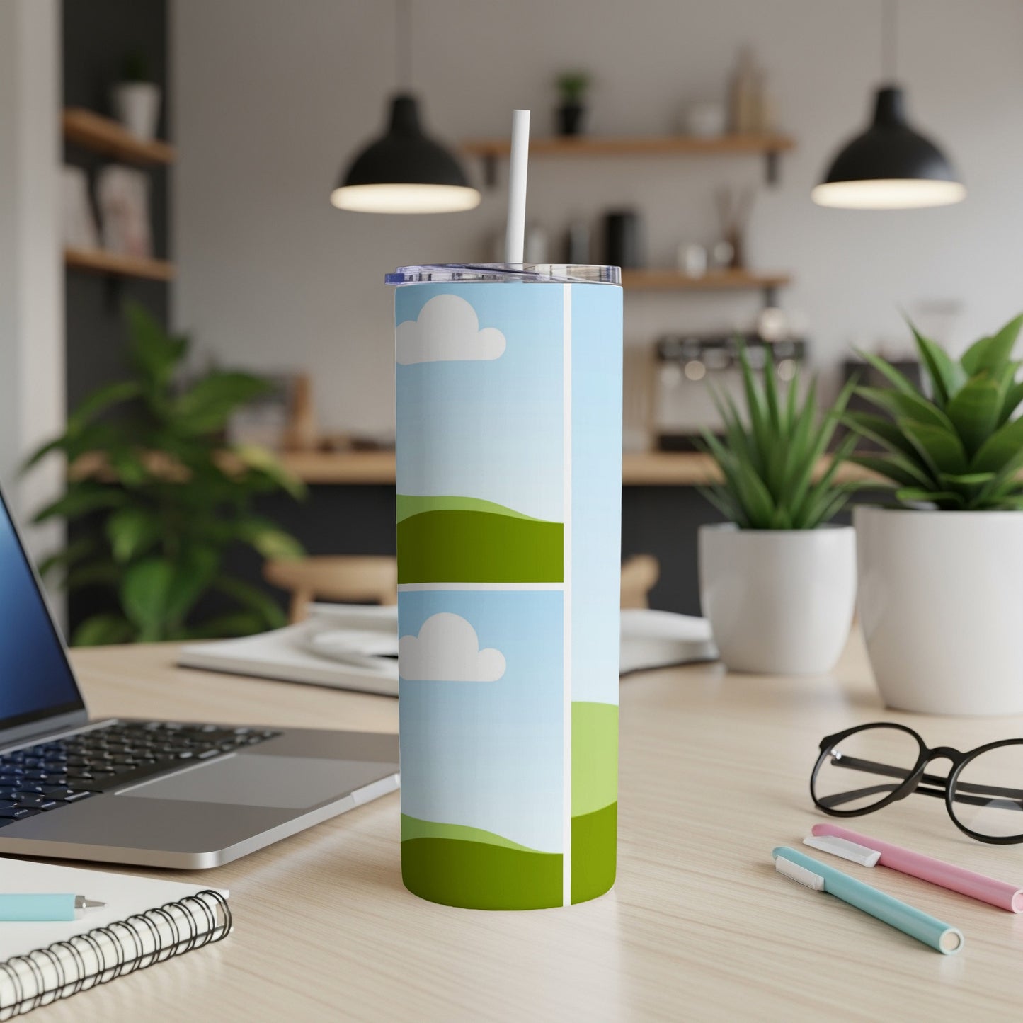 Tall tumbler with sky and rolling green hills graphic.