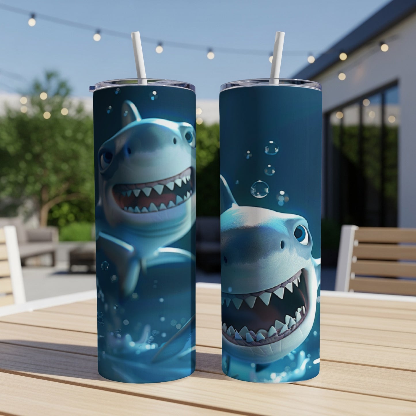 Two tumblers featuring a smiling cartoon shark with bubbles.