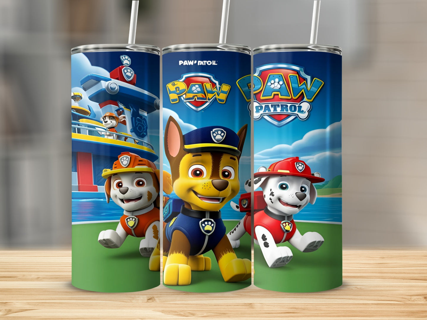 Paw Patrol characters Chase, Marshall, and Ryder on a blue and green tumbler.