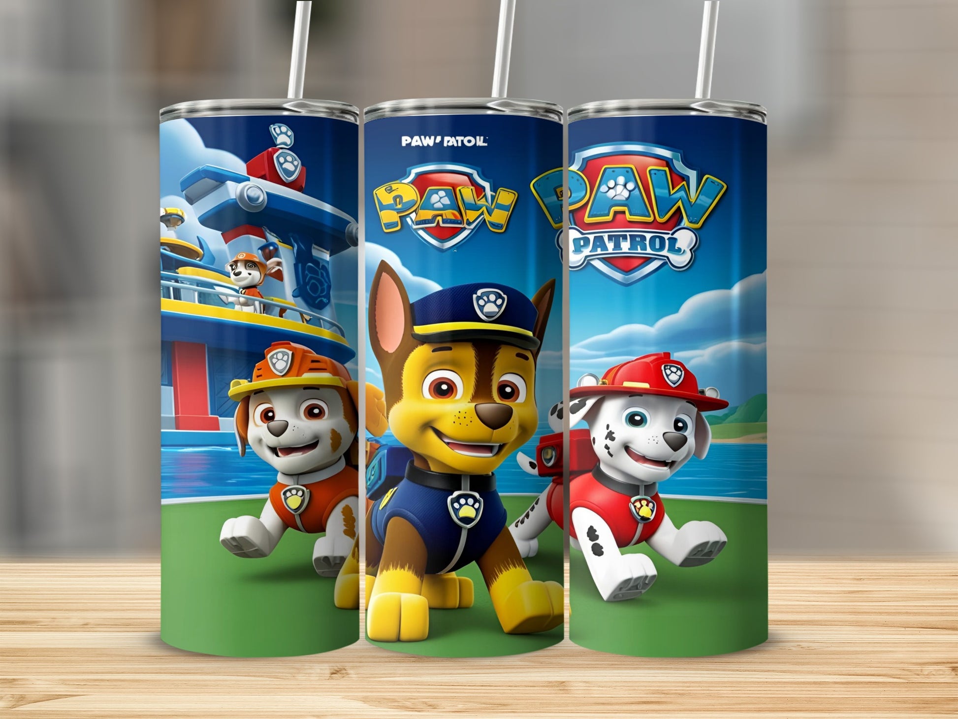 Paw Patrol characters Chase, Marshall, and Ryder on a blue and green tumbler.