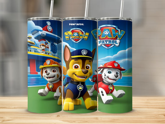 Paw Patrol characters Chase, Marshall, and Ryder on a blue and green tumbler.