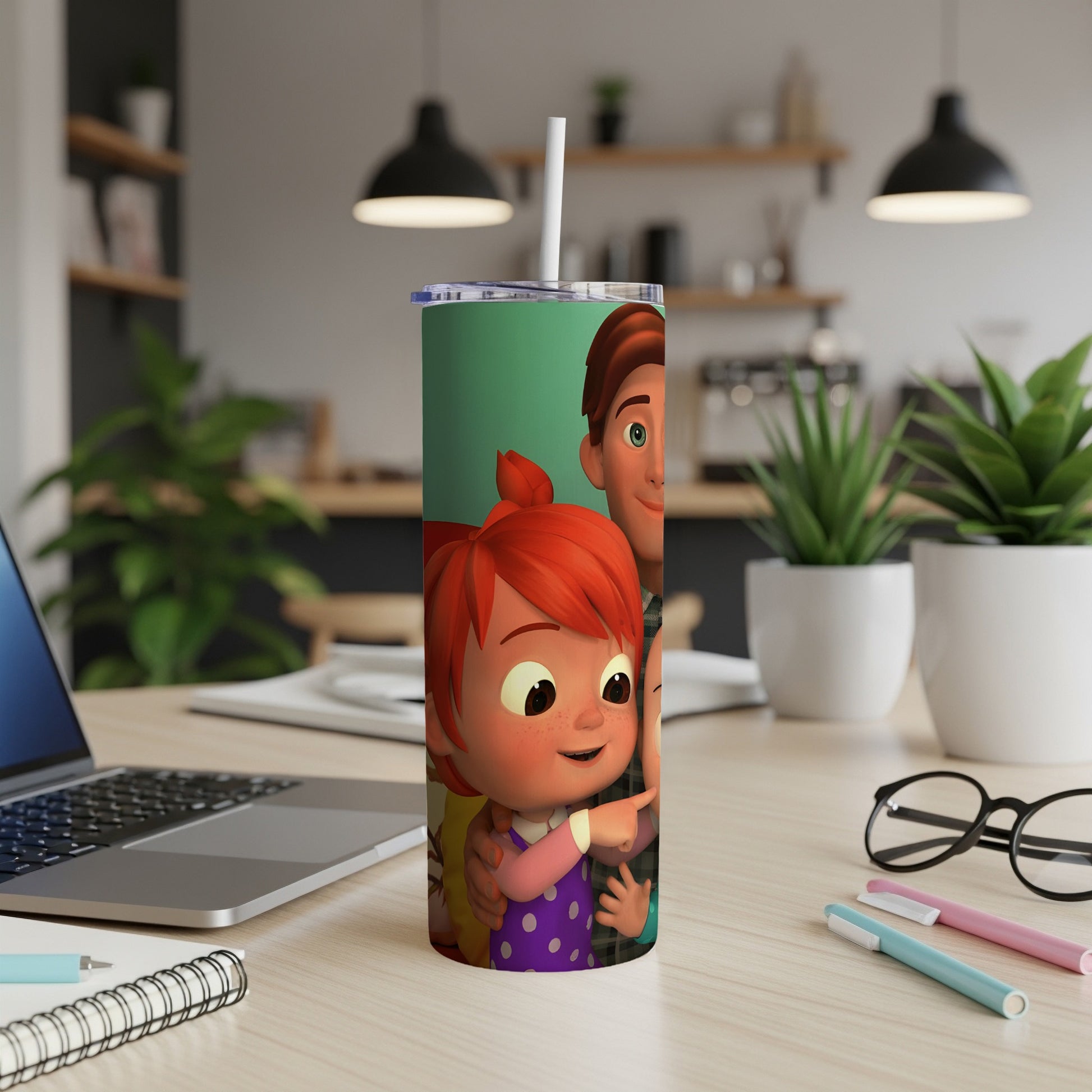Cocomelon characters on a slim tumbler with a straw, on a desk.