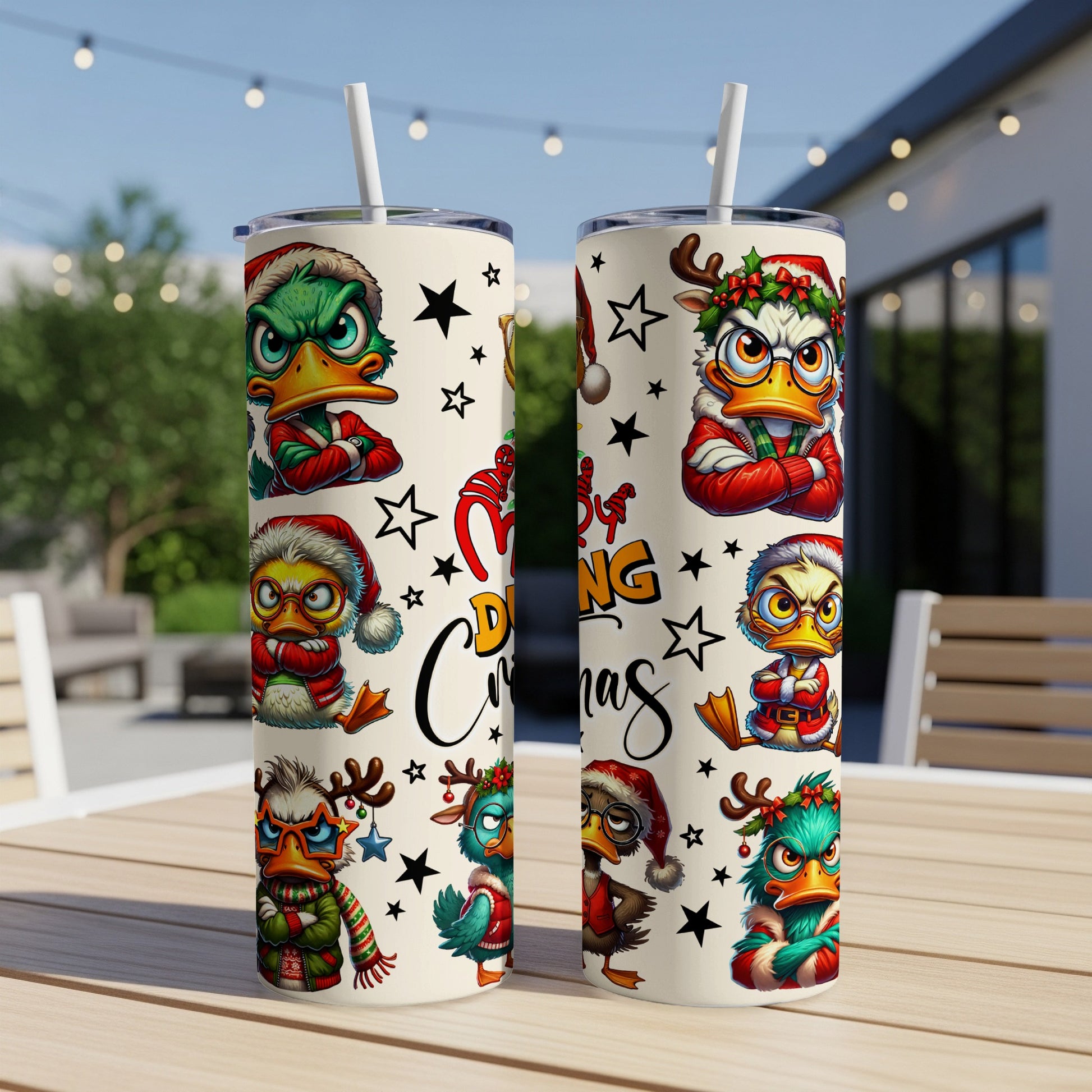 Two festive duck tumblers with Christmas designs and straw.