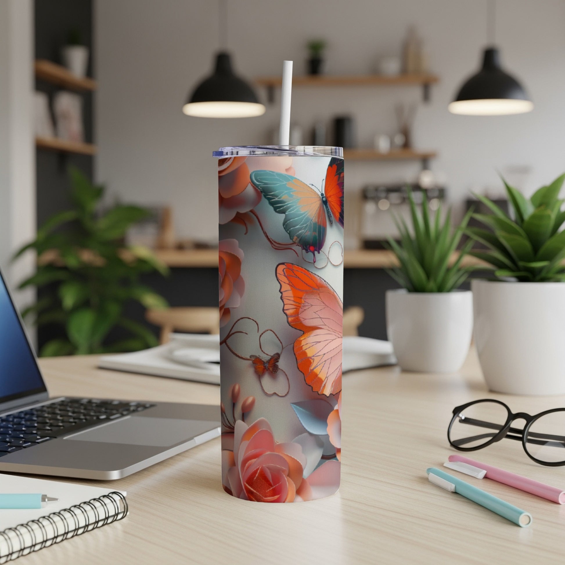 Tall tumbler with butterflies and roses design.