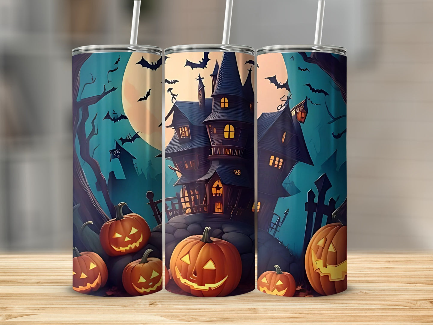 Three tumblers feature a spooky Halloween scene with a haunted house, pumpkins, bats, and a large moon.