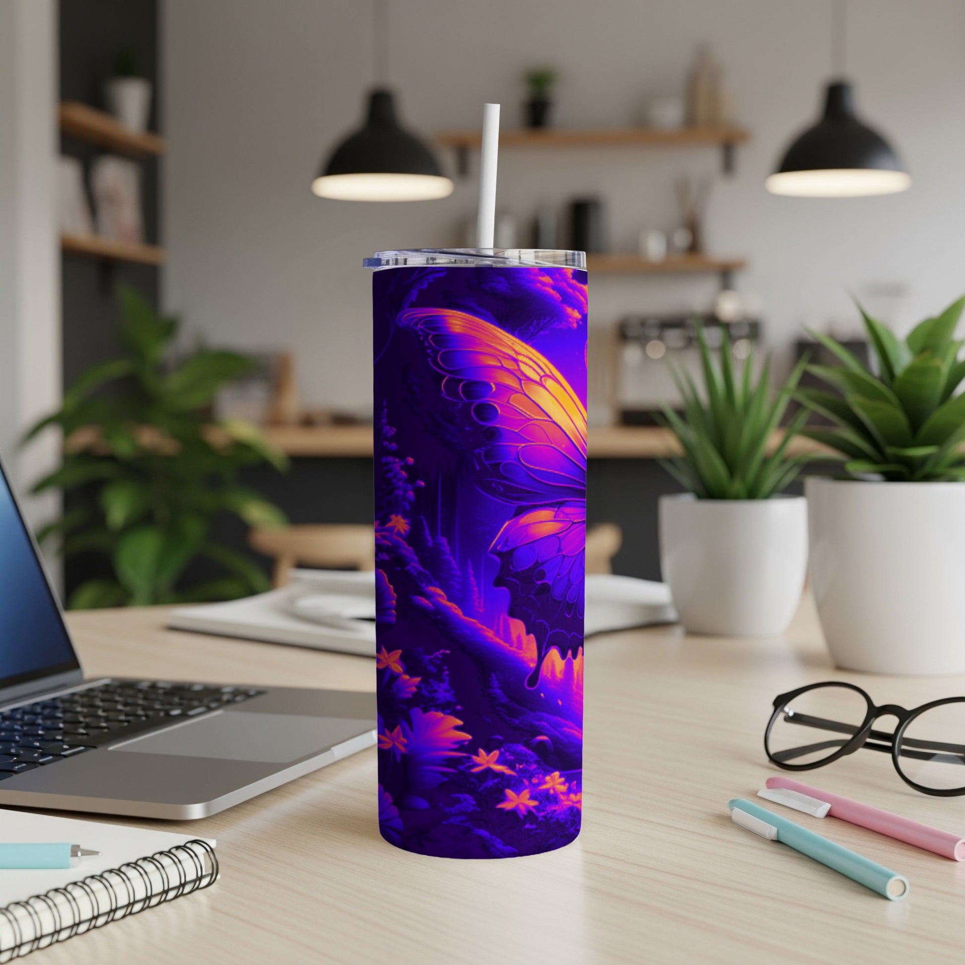 Purple and yellow butterfly design on a tumbler with a straw.